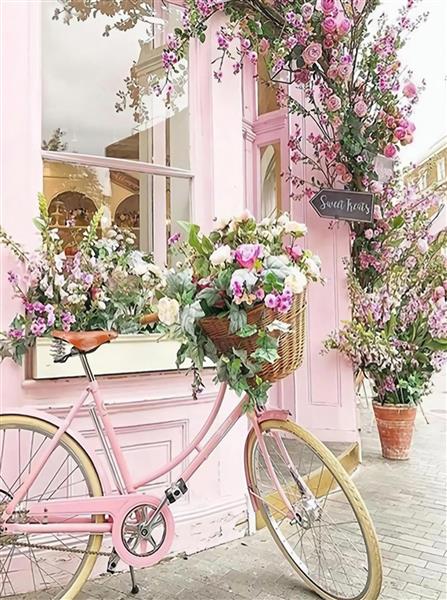 دوچرخه صورتی و گل های رنگی