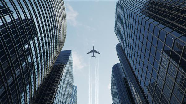 پرواز هواپیما بر فراز مرکز تجاری آسمان خراش ها نمای پایین آسمان‌خراش‌ها با هواپیمای پرنده در یک روز آفتابی روشن منطقه تجاری