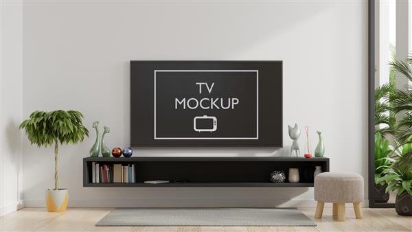 تلویزیون هوشمند روی دیوار سفید در اتاق نشیمن