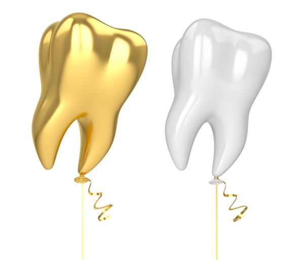 بادکنک به شکل دندان در زمینه سفید با روبان طلایی رندر سه بعدی