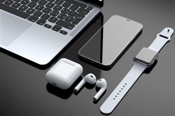 لپ تاپ آلومینیومی واقعی با ساعت هوشمند هدفون و تلفن جدا شده در پس زمینه سیاه مفهوم رندر سه بعدی تجهیزات طراح خلاق و فضای کاری فشرده