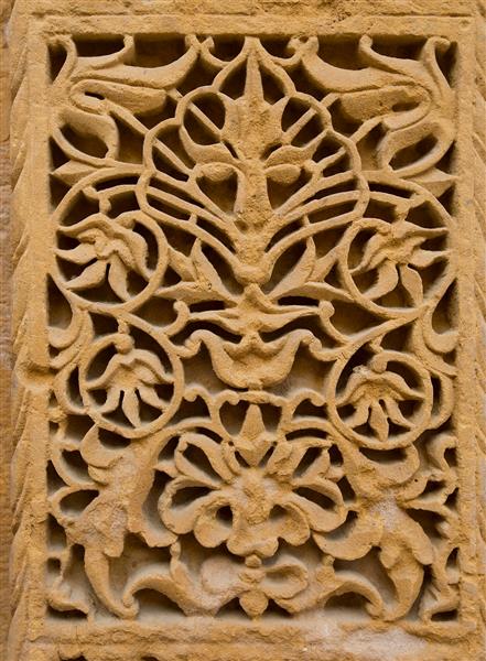 زیور آلات حک شده بر روی دیوارها در جیسالمر هند بافت سنگ ماسه الگوی تزئینی به سبک شرقی بافت دیوار حک شده پس زمینه