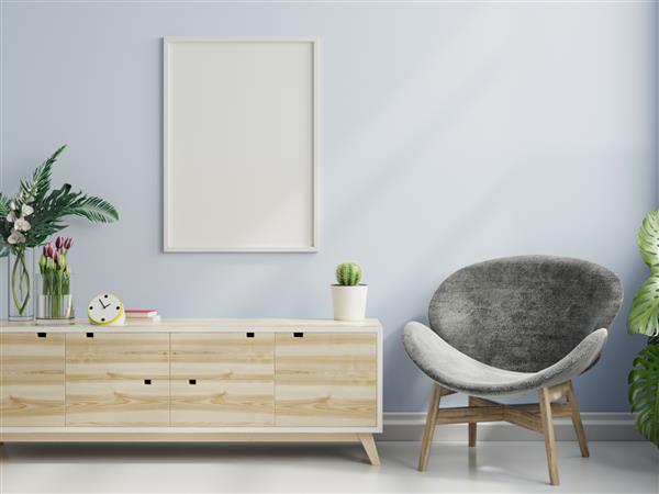 ماکت پوستر با قاب عمودی روی دیوار آبی خالی در فضای داخلی اتاق نشیمن با صندلی راحتی رندر سه بعدی