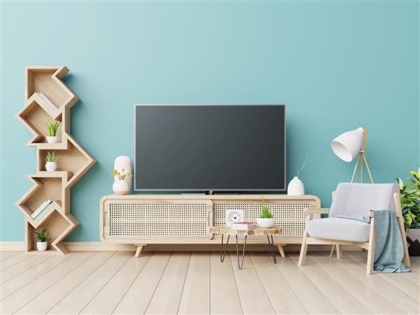 فضای داخلی اتاق نشیمن با صندلی راحتی و کابینت تلویزیون در پس زمینه دیوار آبی خالی رندر سه بعدی