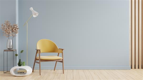 ماکت داخلی اتاق نشیمن با صندلی راحتی زرد روی پس زمینه دیوار رنگ آبی خالی رندر سه بعدی