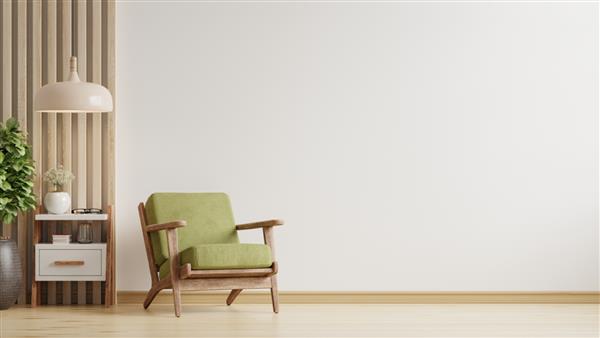 اتاق نشیمن دارای یک صندلی راحتی سبز در پس زمینه دیوار رنگ سفید خالی است
