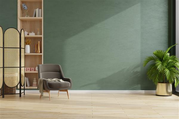 اتاق نشیمن با صندلی راحتی قهوه ای تیره در پس زمینه دیوار سبز تیره خالی