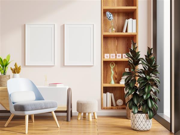 ماکت دو پوستر با قاب های عمودی روی دیوار سفید خالی در فضای داخلی اتاق نشیمن و صندلی راحتی رندر سه بعدی