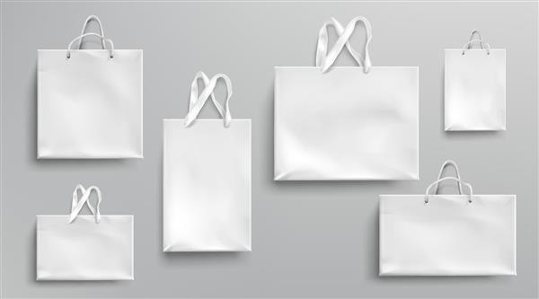 ماکت کیسه‌های خرید کاغذی بسته‌های سفید با دسته‌های طناب و توری بسته‌های هدیه اکولوژیکی مستطیلی خالی ماکت ایزوله برای طراحی برند و هویت شرکتی مجموعه وکتور سه بعدی واقعی