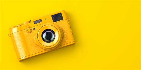 دوربین عکاسی قدیمی زرد در پس زمینه زرد تصویر سه بعدی