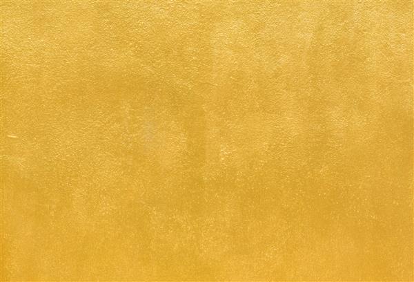 جزئیات پس زمینه بافت طلایی رنگ طلایی روی دیوار سیمانی برای پس زمینه و کاغذ دیواری