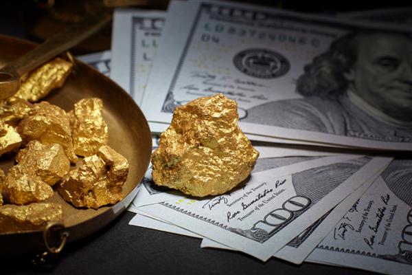 اسکناس های طلا و دلار مفهوم تجاری