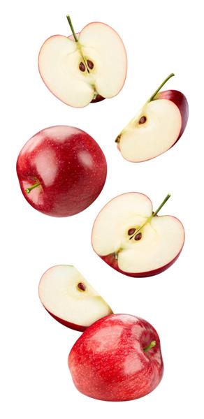 پرواز در مجموعه سیب هوا سیب قرمز جدا شده در پس زمینه سفید ماکرو اپل با مسیر برش