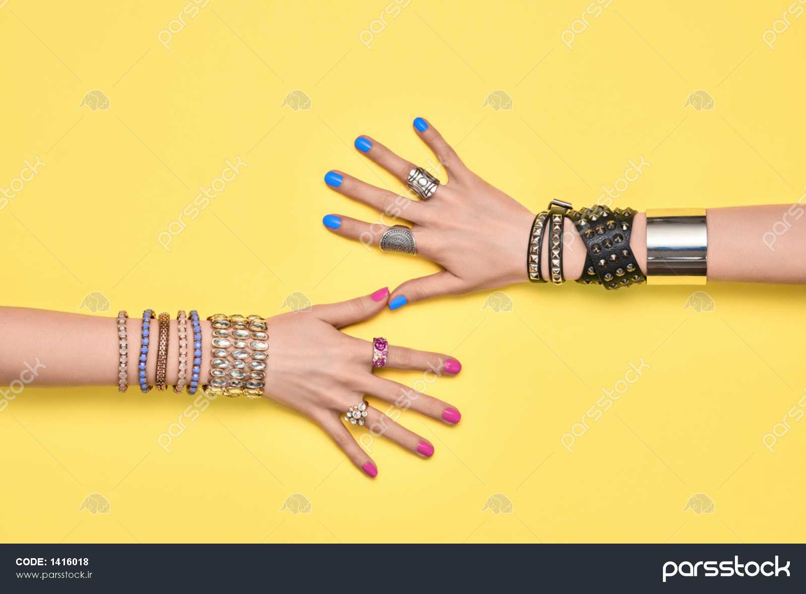 Fashion. Female hand, Stylish Trendy Jewelry. Minimal Design. Accessories  Set. Glamor bracelets Ring. Summer Hipster Girl Essentials. Creative Art.  Handshake Friendship concept Stock Photo